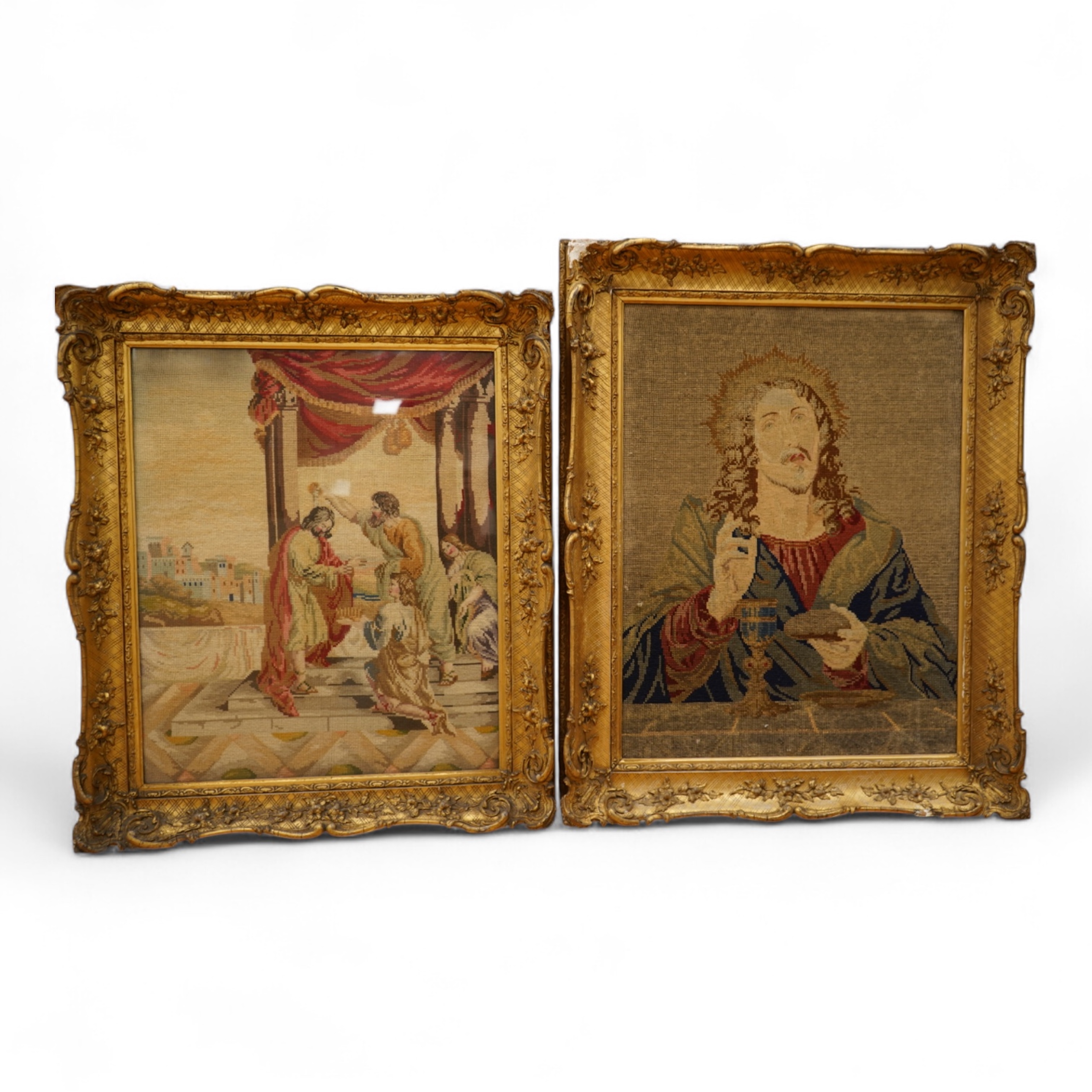 Two Victorian woolwork embroideries, one depicting Christ, the other John the Baptist both in carved gilt frames, largest 82cm high x 66cm wide